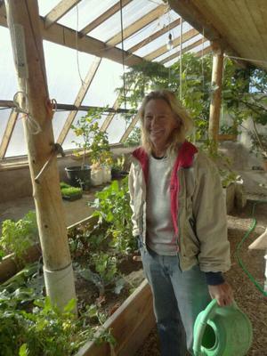 Lori in her balmy greenhouse